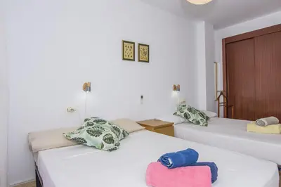 Cama o camas de una habitación en Un Paso del Mar Apartment