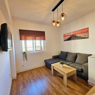 Una televisión o centro de entretenimiento en Precioso apartamento con estilo.