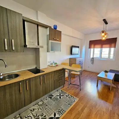 Una cocina o zona de cocina en Precioso apartamento con estilo.