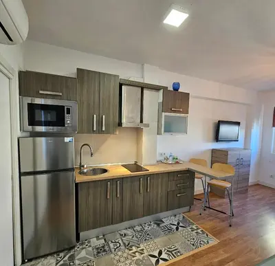 Una cocina o zona de cocina en Precioso apartamento con estilo.