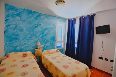 Cama o camas de una habitación en MARLOP´S ROOMS