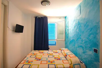 Cama o camas de una habitación en MARLOP´S ROOMS