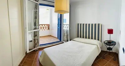 Cama o camas de una habitación en Apartamento de 3 dormitorios a 60 m de la playa en la Isleta, Cabo de Gata