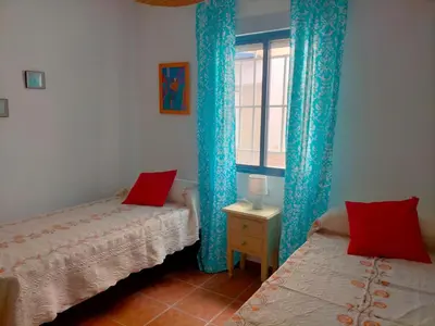 Cama o camas de una habitación en Apartamento con encanto, terraza y parking cubierto