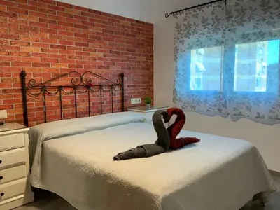 Cama o camas de una habitación en ¡Cómo en casa! Precioso apartamento en Almería