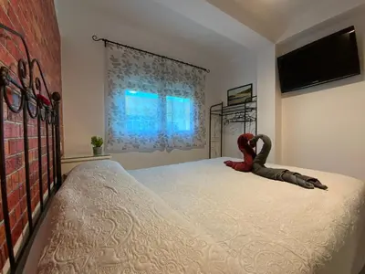 Cama o camas de una habitación en ¡Cómo en casa! Precioso apartamento en Almería
