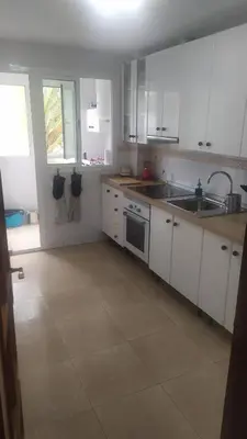 Una cocina o zona de cocina en HABITACIONES EN frente DEL PUERTO