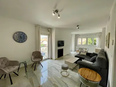 Una televisión o centro de entretenimiento en Apartamentos Valparaiso II