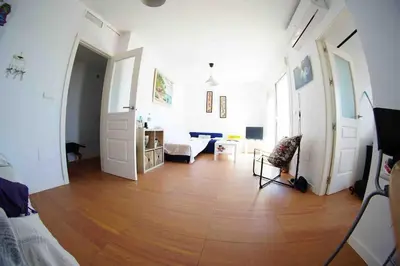 Una televisión o centro de entretenimiento en Ático con terraza en el Toyo