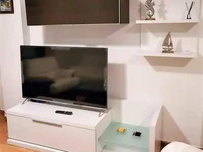 Una televisión o centro de entretenimiento en Belvilla by OYO Valle del Este las Yucas