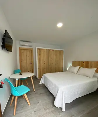 Cama o camas de una habitación en Alojamientos Tía María