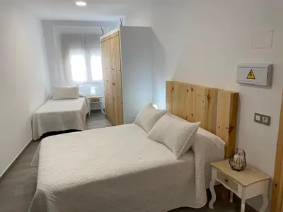 Cama o camas de una habitación en Alojamientos Tía María