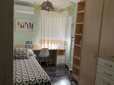 Cama o camas de una habitación en BRISA DE PONIENTE con cochera y aire acondicionado