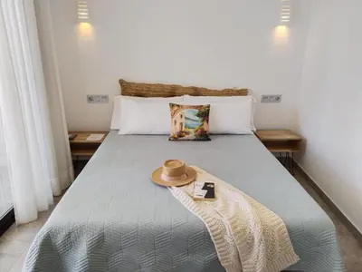 Cama o camas de una habitación en Hostal Aires del Mar