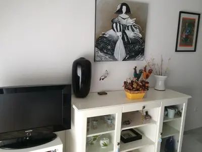 Una televisión o centro de entretenimiento en Apartamento Golf Playaserena