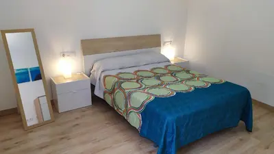 Cama o camas de una habitación en Coqueto apartamento con terraza en la playa