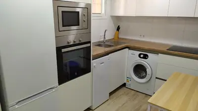 Una cocina o zona de cocina en Coqueto apartamento con terraza en la playa