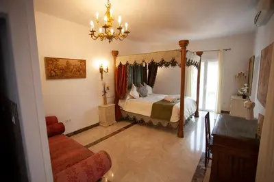 Cama o camas de una habitación en El Palacete de Cuevas