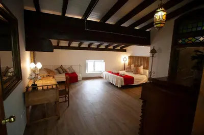 Cama o camas de una habitación en El Palacete de Cuevas