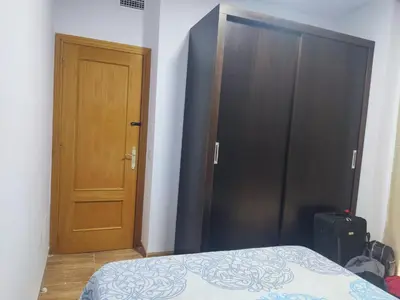 Cama o camas de una habitación en Apartamentos a 300 metros playa