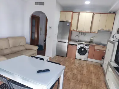 Una cocina o zona de cocina en Apartamentos a 300 metros playa