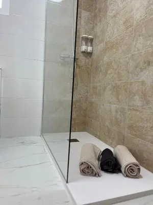 Un baño de Fabuloso apartamento,1a línea de playa a estrenar.