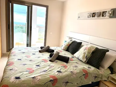 Cama o camas de una habitación en El pequeño paraíso