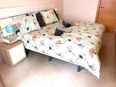 Cama o camas de una habitación en El pequeño paraíso