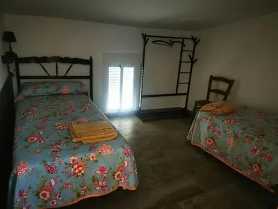 Cama o camas de una habitación en La Casa de los Pájaros