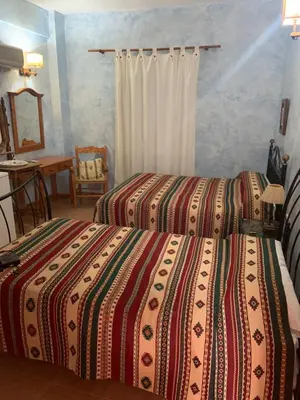 Cama o camas de una habitación en Hotel Azabache