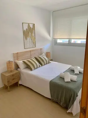 Cama o camas de una habitación en Precioso apartamento primera línea de playa
