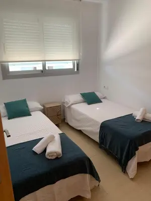 Cama o camas de una habitación en Precioso apartamento primera línea de playa