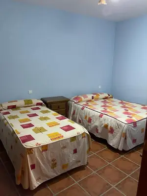 Cama o camas de una habitación en Albergue Rural Gorillo