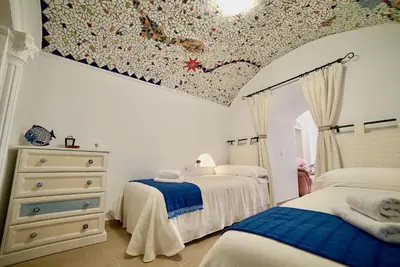 Cama o camas de una habitación en Casa Cueva Los Mosaicos