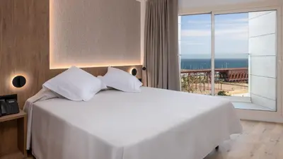 Cama o camas de una habitación en Ohtels Gran Hotel Almeria