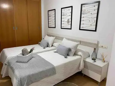 Cama o camas de una habitación en Precioso apartamento en zona de playa