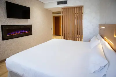 Cama o camas de una habitación en Sercotel Gran Fama