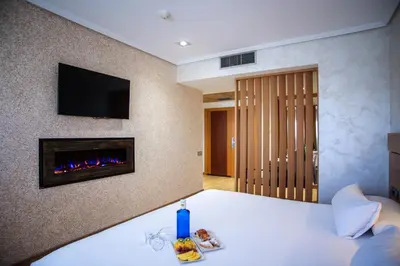 Cama o camas de una habitación en Sercotel Gran Fama