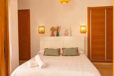 Cama o camas de una habitación en Terraza en Avenida Principal y junto a la Playa - by Aloha Palma
