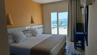 Cama o camas de una habitación en Hotel Playa Bocaina