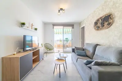 Una televisión o centro de entretenimiento en TrendyHomes Puerto - Vistas al mar, parking incluido, playa a un paso