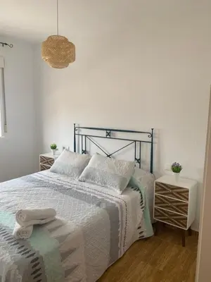 Cama o camas de una habitación en Acogedor apartamento en el paraiso