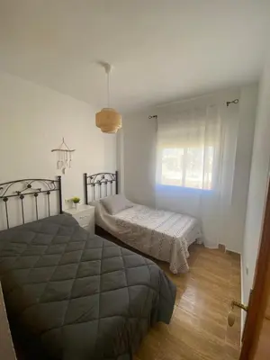 Cama o camas de una habitación en Acogedor apartamento en el paraiso