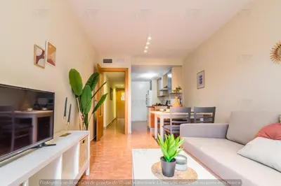 Una televisión o centro de entretenimiento en Duplex PARAISO VERA Playa PISCINA PRIVADA