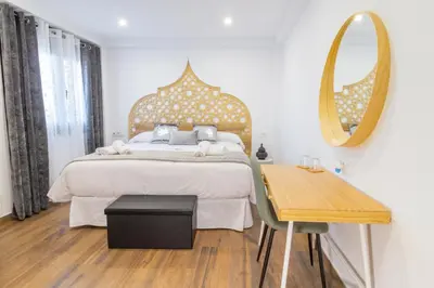 Cama o camas de una habitación en Hotel Reina Aixa
