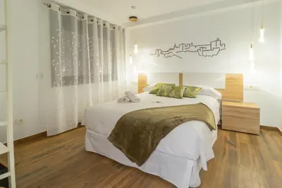 Cama o camas de una habitación en Hotel Reina Aixa