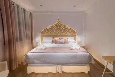 Cama o camas de una habitación en Hotel Reina Aixa