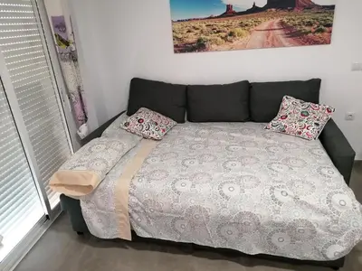 Cama o camas de una habitación en Alojamiento Las Dunas Bajo