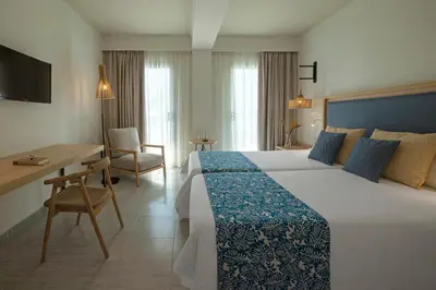 Cama o camas de una habitación en Hotel Cabogata Jardín