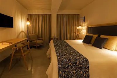 Cama o camas de una habitación en Hotel Cabogata Jardín